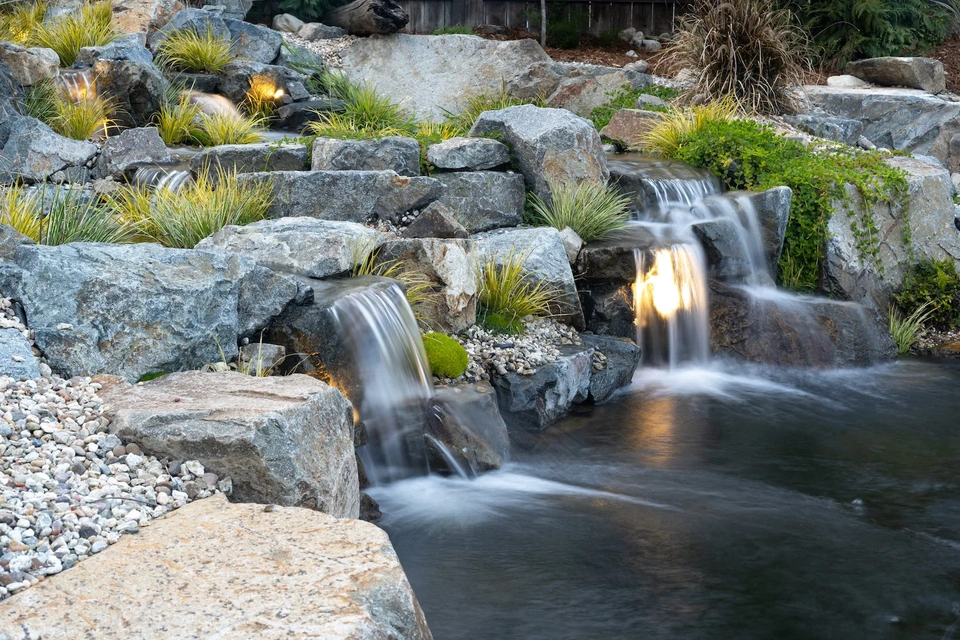 Japanese style large outdoor pond with overhanging observation deck.